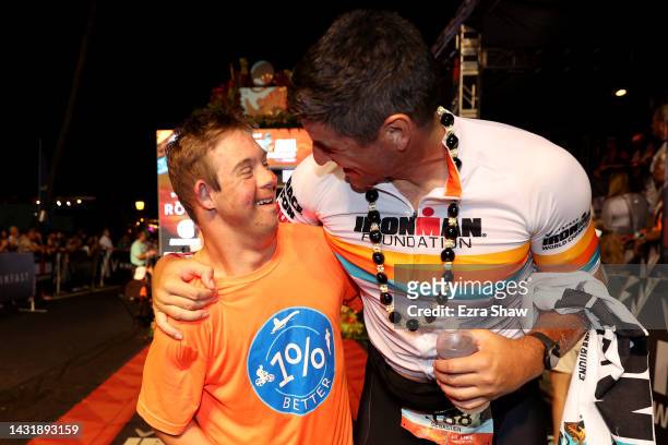 Sebastien Bellin of Belgium celebrates with Chris Nikic after finishing the IRONMAN World Championships on October 08, 2022 in Kailua Kona, Hawaii.