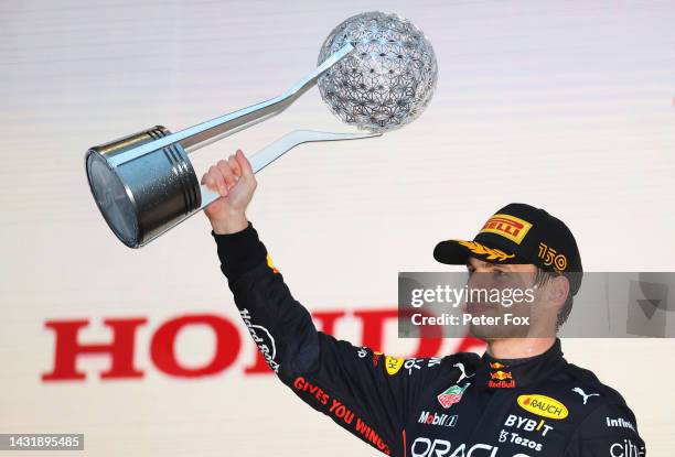 Race winner and 2022 F1 World Drivers Champion Max Verstappen of Netherlands and Oracle Red Bull Racing celebrates on the podium during the F1 Grand...