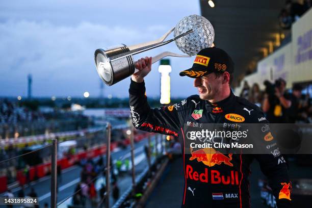 Race winner and 2022 F1 World Drivers Champion Max Verstappen of the Netherlands and Oracle Red Bull Racing celebrates on the podium during the F1...