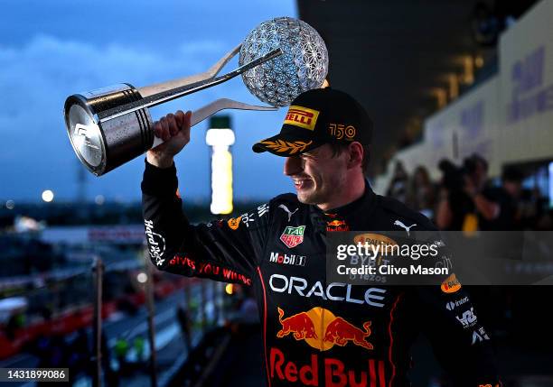 Race winner and 2022 F1 World Drivers Champion Max Verstappen of the Netherlands and Oracle Red Bull Racing celebrates on the podium during the F1...