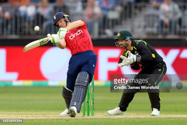 Jos Buttler of England hits the ball for six during game one of the T20 International series between Australia and England at Optus Stadium on...