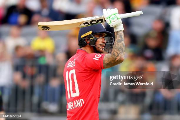 Alex Hales of England raises hit bat for 50 runs during game one of the T20 International series between Australia and England at Optus Stadium on...