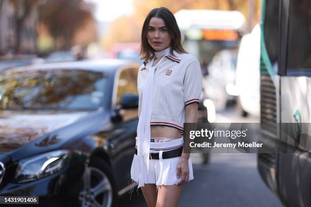 Bambi Northwood-Blyth seen wearing full Miu Miu look, white Miu Miu shirt, white short skirt with a black belt and black loafer, outside Miu Miu...