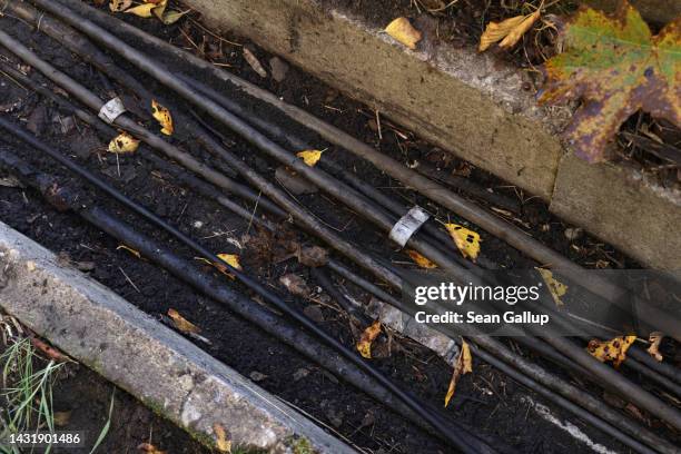 Cables lie in a concrete shaft next to railway tracks at the spot in Hohenschoenhausen district where the day before technicians repaired a section...