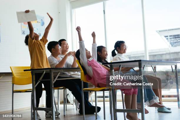 students cheering at the end of a class - summer school stock pictures, royalty-free photos & images