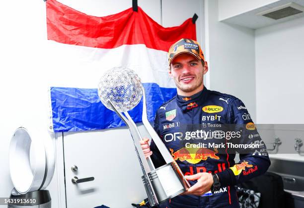 Race winner and 2022 F1 World Drivers Champion Max Verstappen of Netherlands and Oracle Red Bull Racing celebrates with his trophy after the F1 Grand...