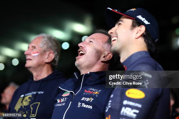 Red Bull Racing Team Principal Christian Horner and Second placed Sergio Perez of Mexico and Oracle Red Bull Racing watch the race highlights on a...