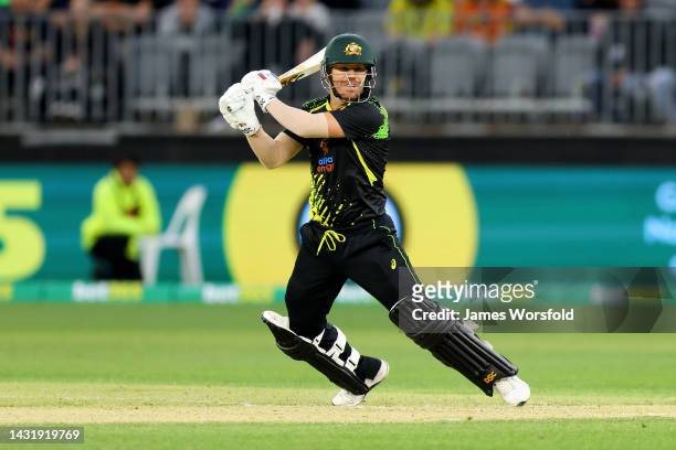 David Warner of Australia plays a cut shot during game one of the T20 International series between Australia and England at Optus Stadium on October...