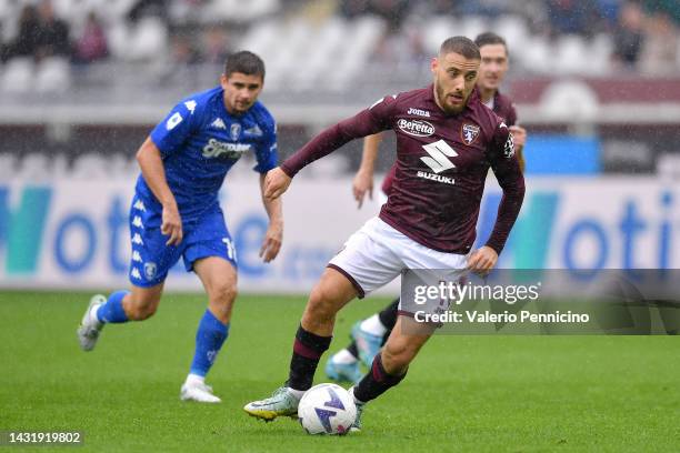 Nikola Vlasic of Torino FC runs with the ball during the Serie A match between Torino FC and Empoli FC at Stadio Olimpico di Torino on October 09,...