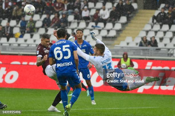 Guglielmo Vicario of Empoli FC makes a save against Antonio Sanabria of Torino FC during the Serie A match between Torino FC and Empoli FC at Stadio...
