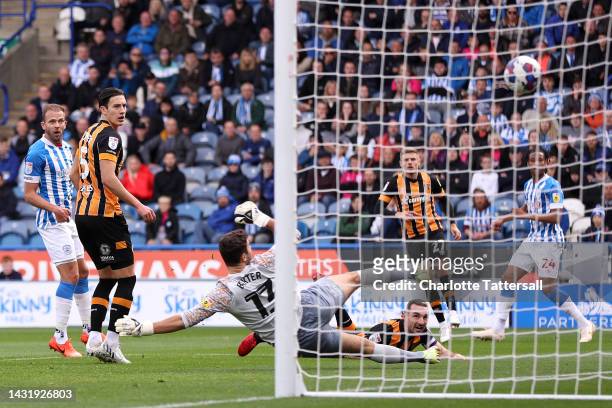 Lewis Coyle of Hull City looks on as they score an own goal, the first goal for Huddersfield Town during the Sky Bet Championship between...