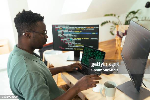 smart young man coding - smart numbers office stockfoto's en -beelden