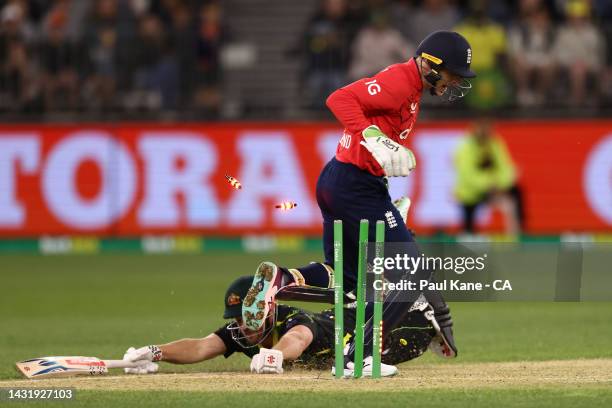 Jos Buttler of England celebrates as Aaron Finch of Australia is run out during game one of the T20 International series between Australia and...