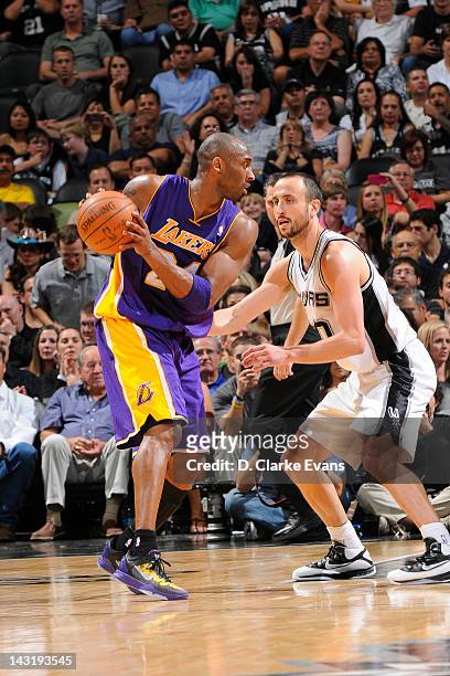 Kobe Bryant of the Los Angeles Lakers moves the ball against Manu Ginobili of the San Antonio Spurs on April 20, 2012 at the AT&T Center in San...