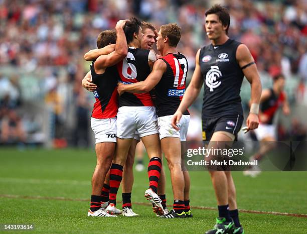 Angus Monfries of the Bombers celebrates a goal with teammates during the round four AFL match between the Carlton Blues and the Essendon Bombers at...