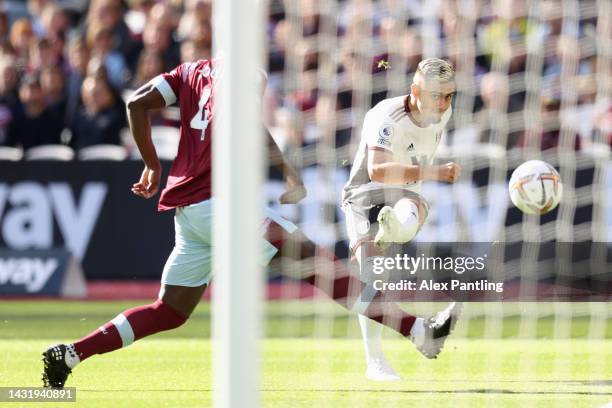 Andreas Pereira of Fulham scores their team's first goal during the Premier League match between West Ham United and Fulham FC at London Stadium on...