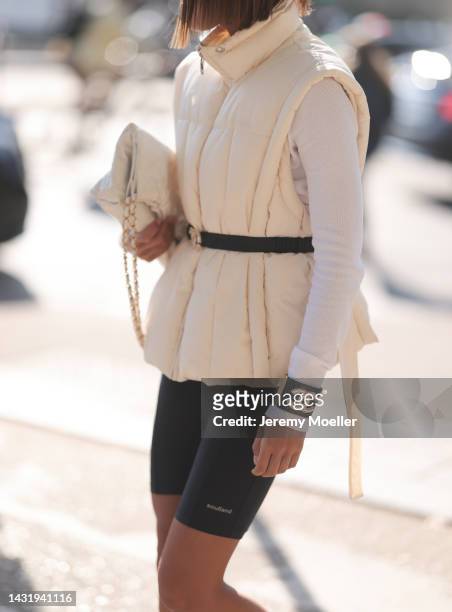 Fashion week guest seen wearing soulland black short leggings and a white west, outside Chanel during Paris Fashion Week on October 04, 2022 in...