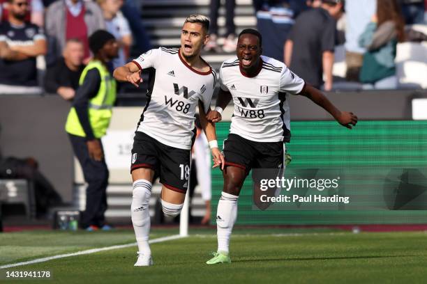 Andreas Pereira celebrates with Neeskens Kebano of Fulham after scoring their team's first goal during the Premier League match between West Ham...