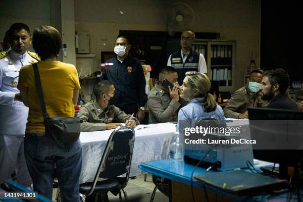 Journalists, Anna Coren and Daniel Hodge, speak to police after being detained for entering the crime scene of a mass shooting at a daycare center on...