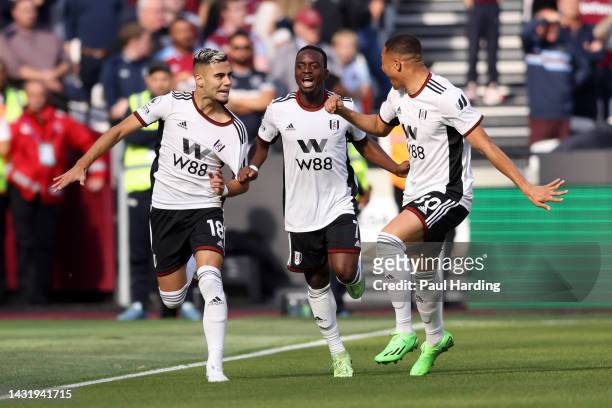 Andreas Pereira celebrates with Neeskens Kebano and Carlos Vinicius of Fulham after scoring their team's first goal during the Premier League match...