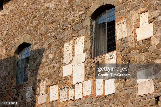 Tiles at the Old City Hall celebrating each year's wine vintage, Le Annate del Brunello, Montalcino, Val D'Orcia,Tuscany, Italy