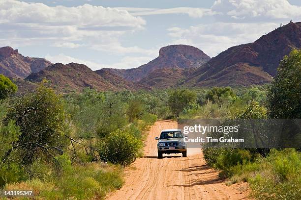 Four-wheel-drive vehicle on the Mereenie-Watarrka Road, Gosse Bluff, Red Centre, Australia