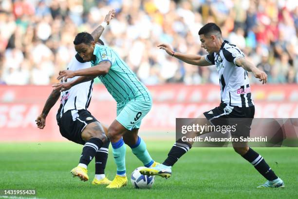 Luis Muriel of Atalanta BC is challenged by Nehuen Perez of Udinese Calcio during the Serie A match between Udinese Calcio and Atalanta BC at Dacia...