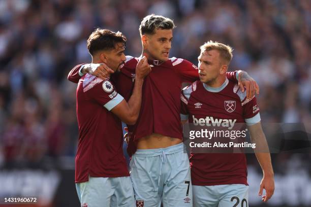 Gianluca Scamacca celebrates with Lucas Paqueta and Jarrod Bowen of West Ham United after scoring their team's second goal during the Premier League...