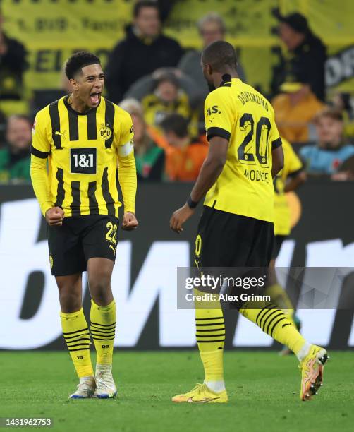 Anthony Modeste of Borussia Dortmund celebrates their team's second goal with teammate Jude Bellingham during the Bundesliga match between Borussia...