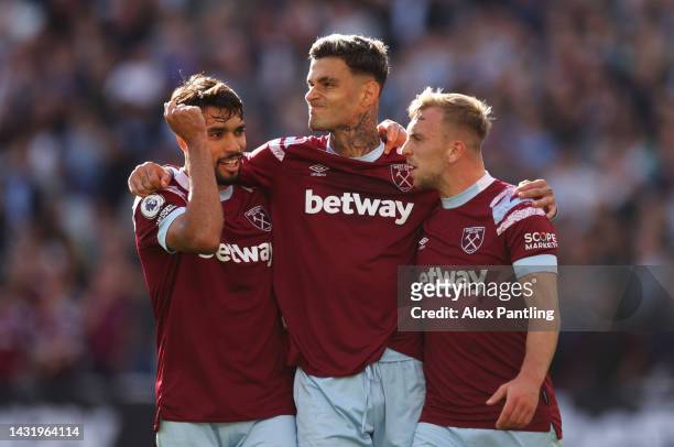 Gianluca Scamacca celebrates with Lucas Paqueta and Jarrod Bowen of West Ham United after scoring their team's second goal during the Premier League...
