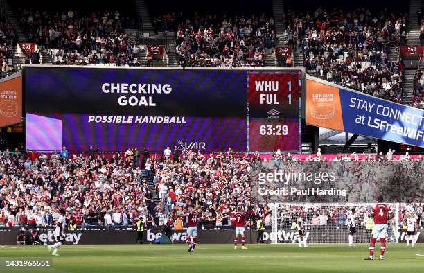 General view inside the stadium as the LED screen shows the VAR check for Gianluca Scamacca of West Ham United's second goal, which was later given...