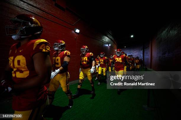 The USC Trojans walk to the field before a game against the Washington State Cougars at United Airlines Field at the Los Angeles Memorial Coliseum on...