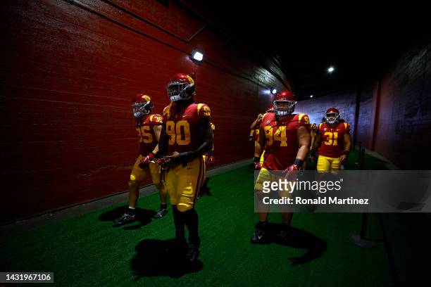 The USC Trojans walk to the field before a game against the Washington State Cougars at United Airlines Field at the Los Angeles Memorial Coliseum on...