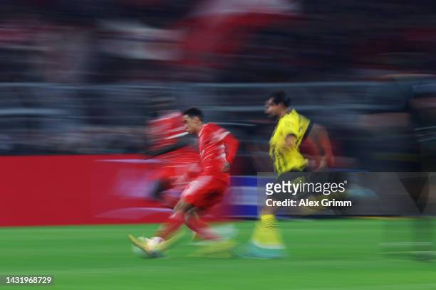 Jamal Musiala of Bayern Muenchen eludes Emre Can of Borussia Dortmund during the Bundesliga match between Borussia Dortmund and FC Bayern München at...