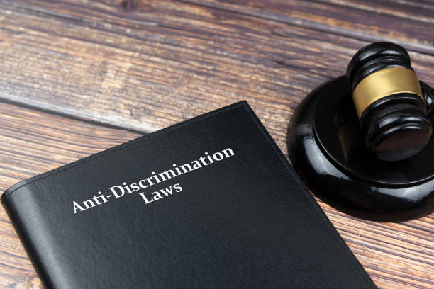 anti discrimination law book and gavel - discrimination stock pictures, royalty-free photos & images