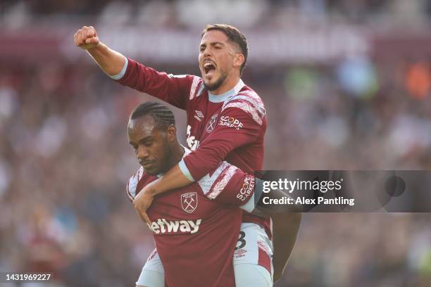 Michail Antonio celebrates with Pablo Fornals of West Ham United after scoring their team's third goal during the Premier League match between West...