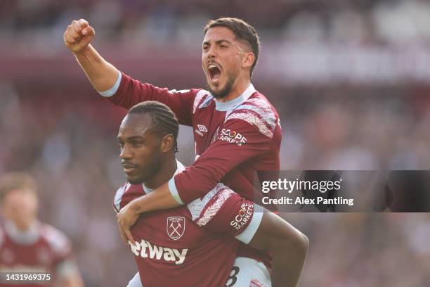 Michail Antonio celebrates with Pablo Fornals of West Ham United after scoring their team's third goal during the Premier League match between West...