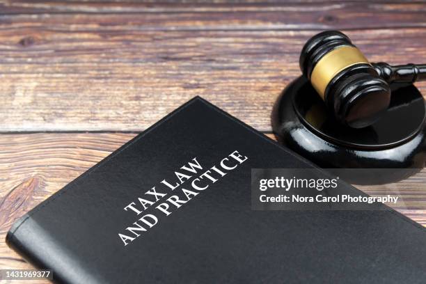 tax law and practice book and gavel - corporate lawsuit stock pictures, royalty-free photos & images