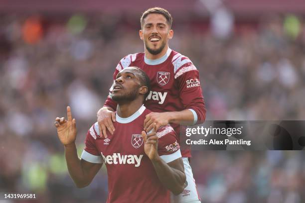 Michail Antonio celebrates with Pablo Fornals of West Ham United after scoring their team's third goal during the Premier League match between West...