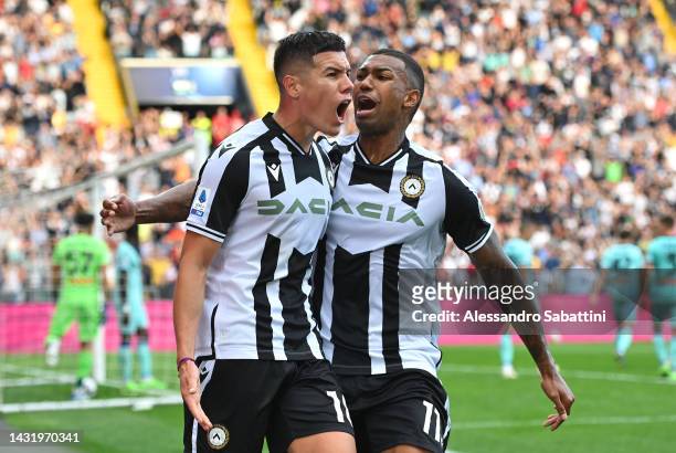 Nehuen Perez of Udinese Calcio celebrates scoring their side's second goal with teammate Walace during the Serie A match between Udinese Calcio and...