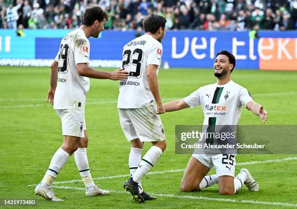 Ramy Bensebaini of Borussia Monchengladbach celebrates with teammates after scoring their team's fourth goal during the Bundesliga match between...