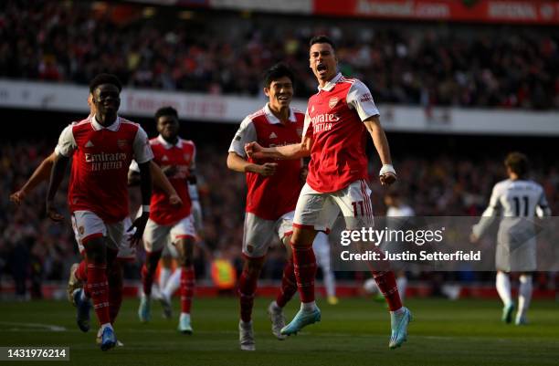 Gabriel Martinelli of Arsenal celebrates after scoring their team's first goal during the Premier League match between Arsenal FC and Liverpool FC at...