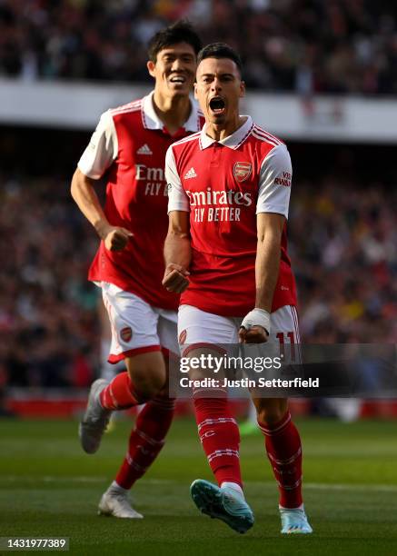 Gabriel Martinelli of Arsenal celebrates after scoring their team's first goal during the Premier League match between Arsenal FC and Liverpool FC at...