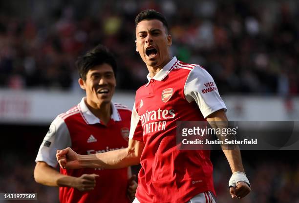 Gabriel Martinelli of Arsenal celebrates after scoring their team's first goal during the Premier League match between Arsenal FC and Liverpool FC at...