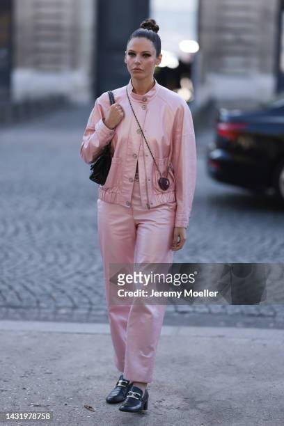 Alizee Gamberini seen wearing a total Chanel pink matching leather look, outside Chanel during Paris Fashion Week on October 04, 2022 in Paris,...