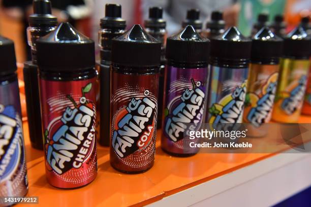 Selection of Fantasi classic soft drink flavoured, including cola and Lemonade vape juice, E-liquids are displayed during the Vaper Expo at National...