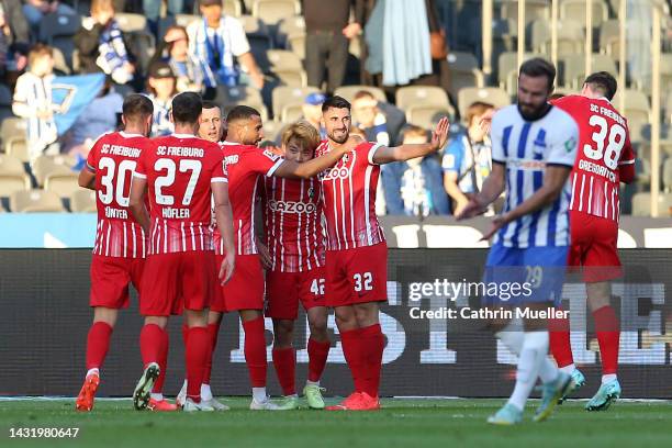Daniel-Kofi Kyereh of SC Freiburg celebrates scoring their side's first goal with teammates during the Bundesliga match between Hertha BSC and...