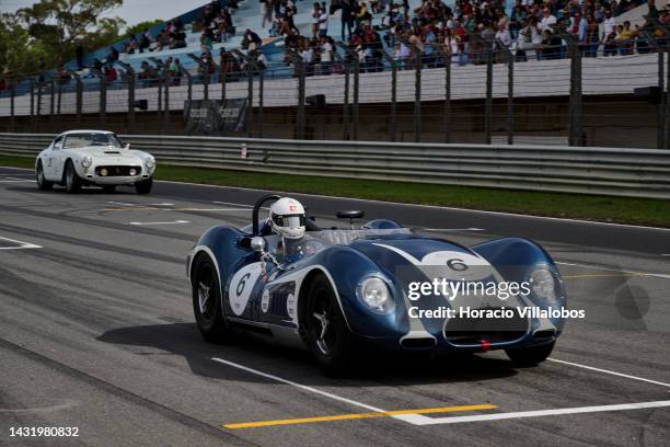 Spectators watch cars speeding by during The Greatest's Trophy race on the last day of Estoril Classics in Fernanda Pires da Silva Estoril Circuit on...