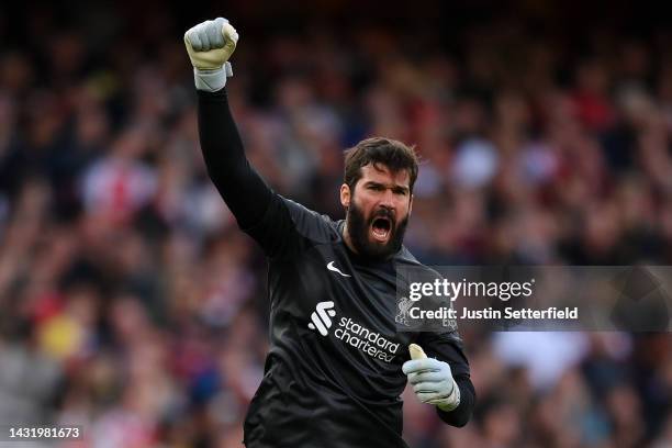 Alisson Becker celebrates after Darwin Nunez of Liverpool scored their sides first goal during the Premier League match between Arsenal FC and...