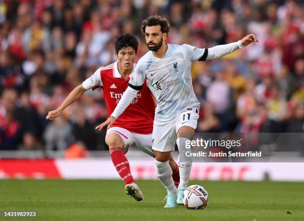 Mohamed Salah of Liverpool is challenged by Takehiro Tomiyasu of Arsenal during the Premier League match between Arsenal FC and Liverpool FC at...